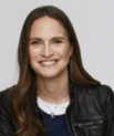 Person, smile, hair, jacket, colors.